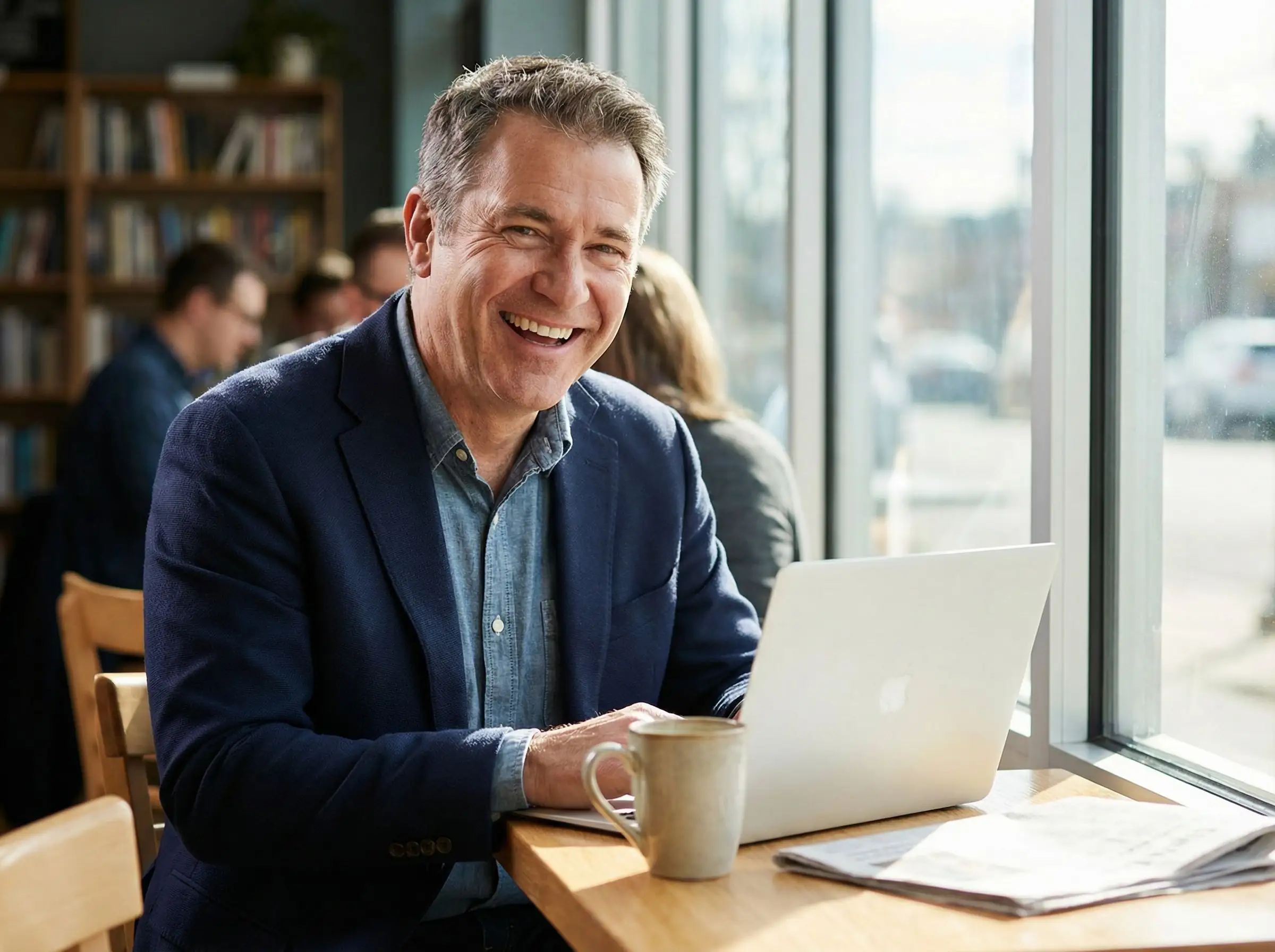 Mature man in coffee shop setting showing lifestyle context for AI dating photos