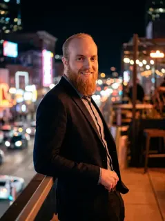 AI-generated dating photo with a golden-hour city skyline backdrop